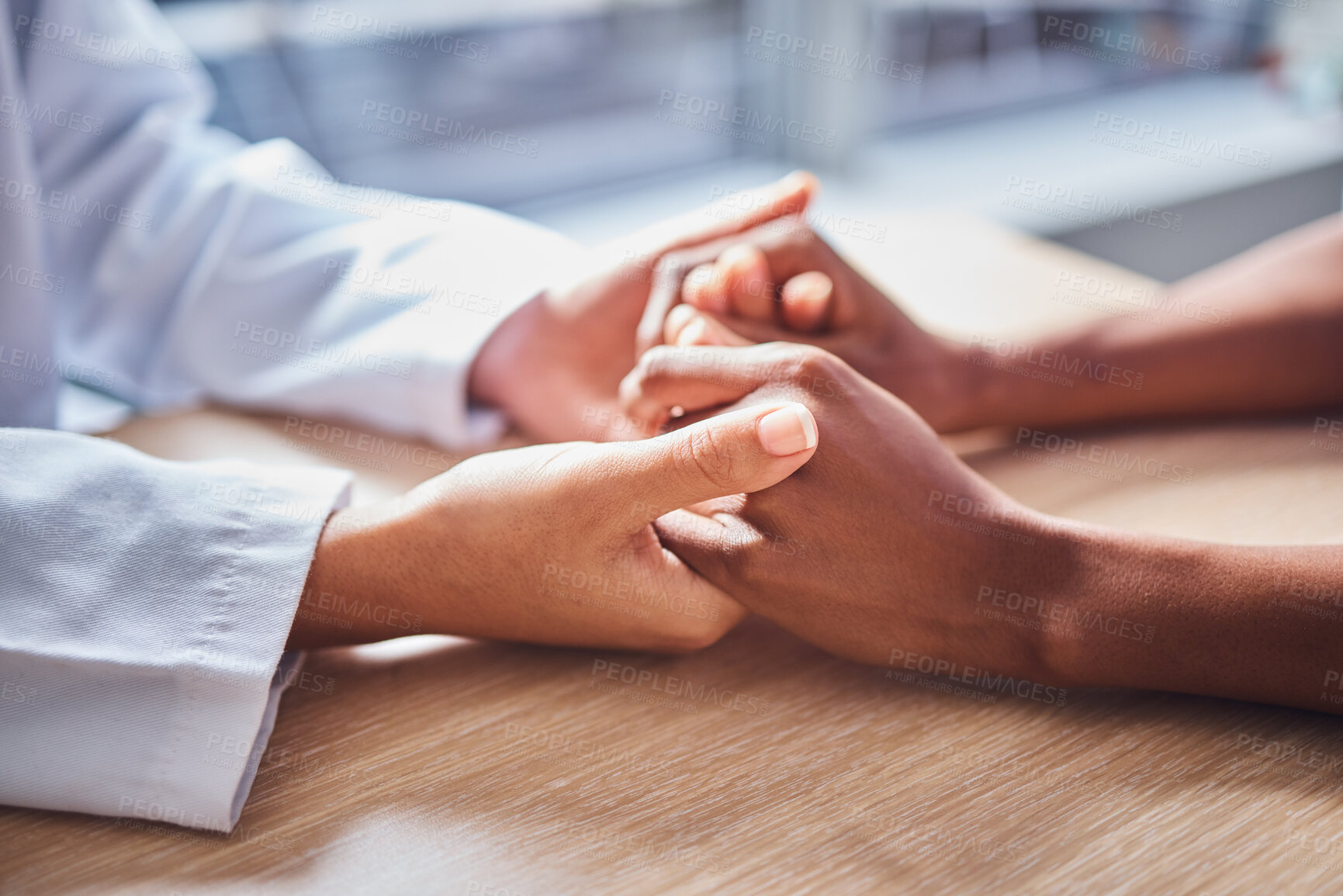 Buy stock photo Holding hands, cancer and doctor in support of patient for comfort, trust and help in a hospital or clinic office. Closeup, care and healthcare professional consulting a person for medical advice