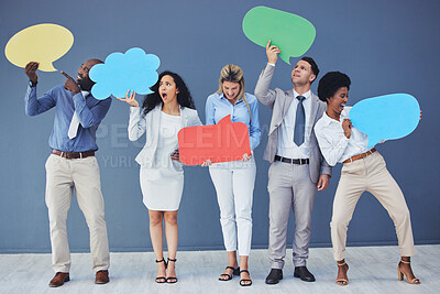 Buy stock photo Speech bubble, team and comment by business people holding sign, news and voice icon feeling excited on social media. Group, opinion and poll by employees with mockup space in studio blue background