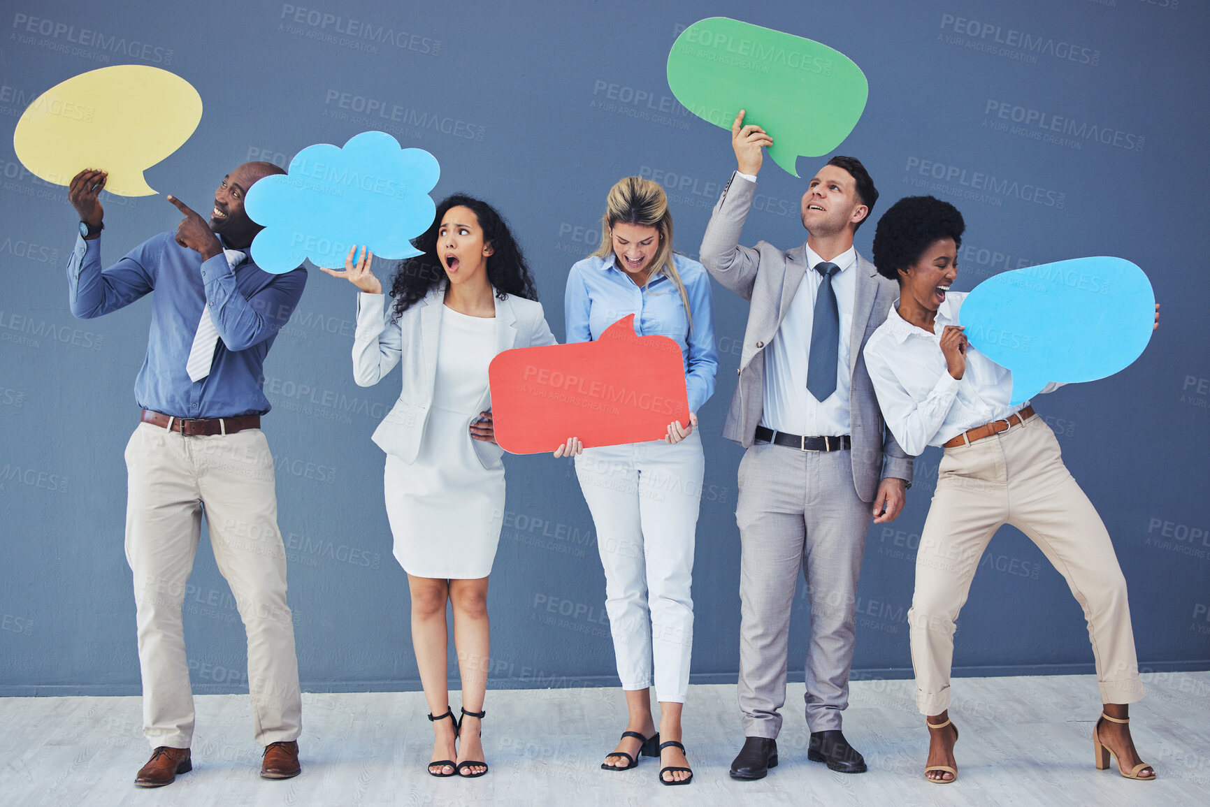 Buy stock photo Speech bubble, team and comment by business people holding sign, news and voice icon feeling excited on social media. Group, opinion and poll by employees with mockup space in studio blue background