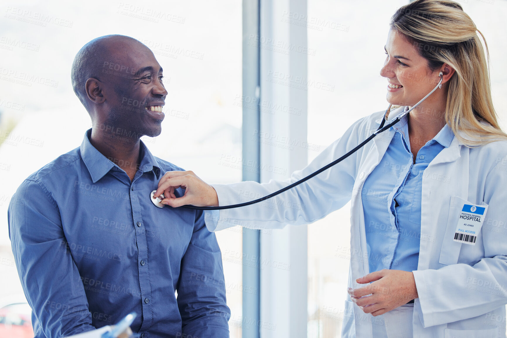 Buy stock photo Doctor woman, patient and consultation with stethoscope in hospital for healthcare or health insurance. Black man and cardiologist person talking about lungs, breathing and advice for healthy heart