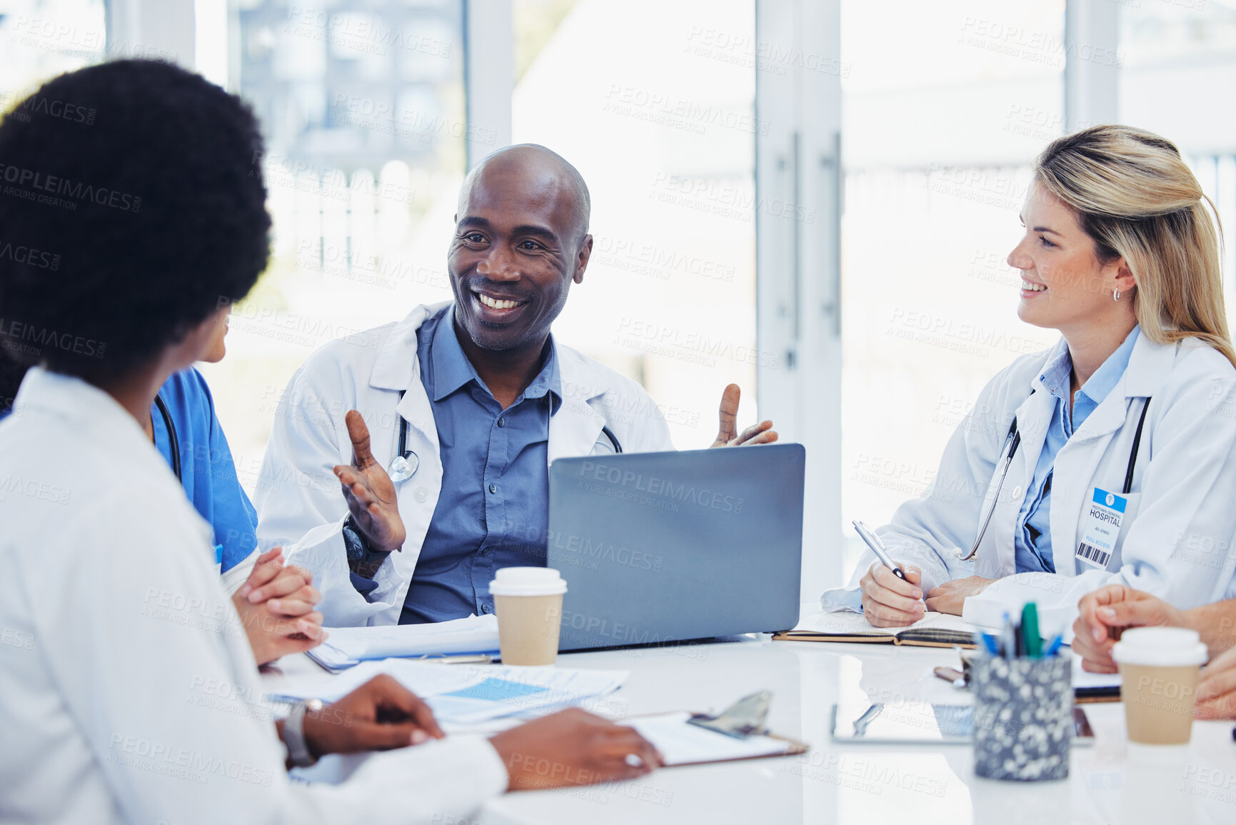 Buy stock photo Medical, meeting and doctors with laptop for research, planning and surgical innovation at hospital. Doctor, team and health experts brainstorm, problem solving and discussing online project together