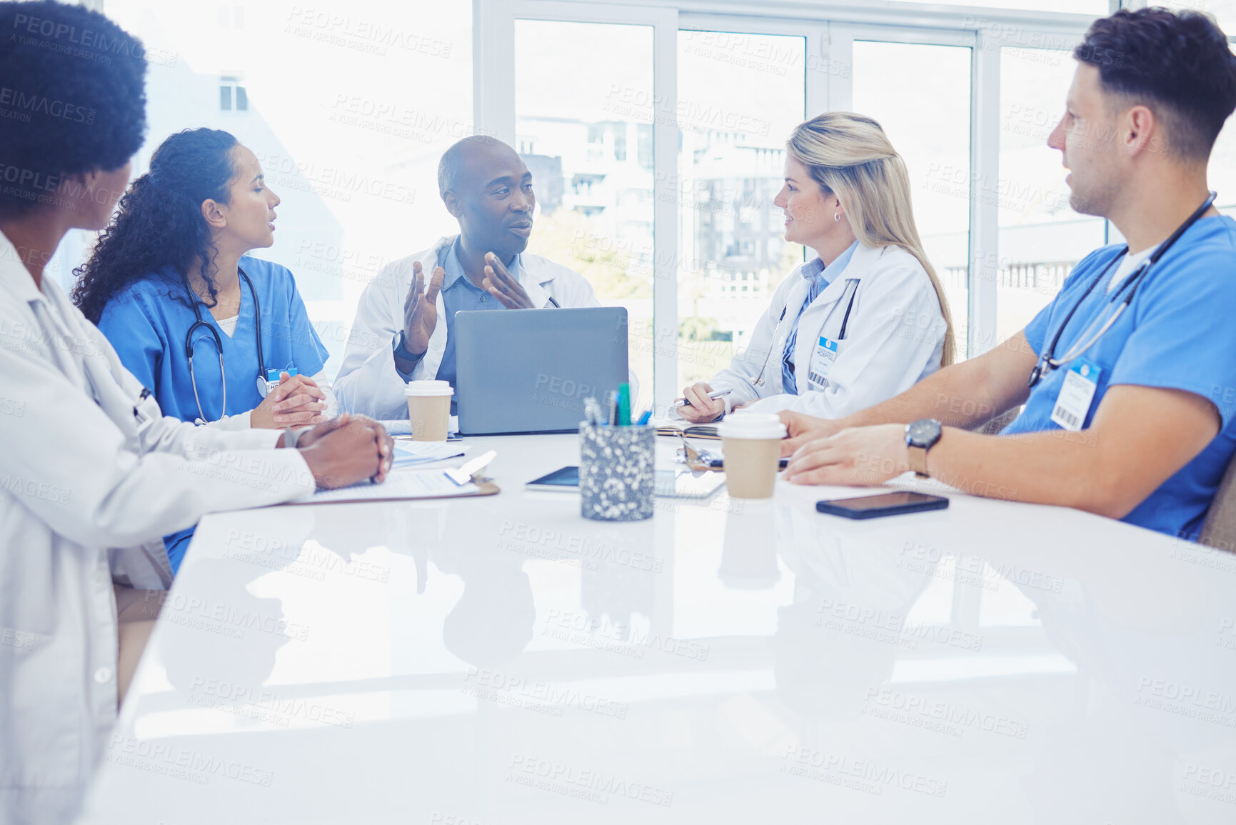 Buy stock photo Healthcare, teamwork and black man in meeting, doctors and conversation for training, research and improvement. African American male, staff and team coaching, mentor and discussion for procedure