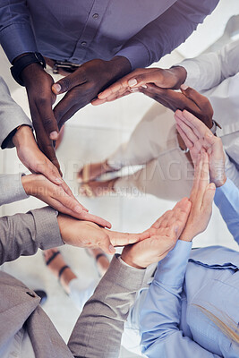 Buy stock photo Hands, collaboration and workflow with a business team standing in a circle at the office from above. Meeting, partnership and teamwork with a group of people in a huddle for growth or synergy