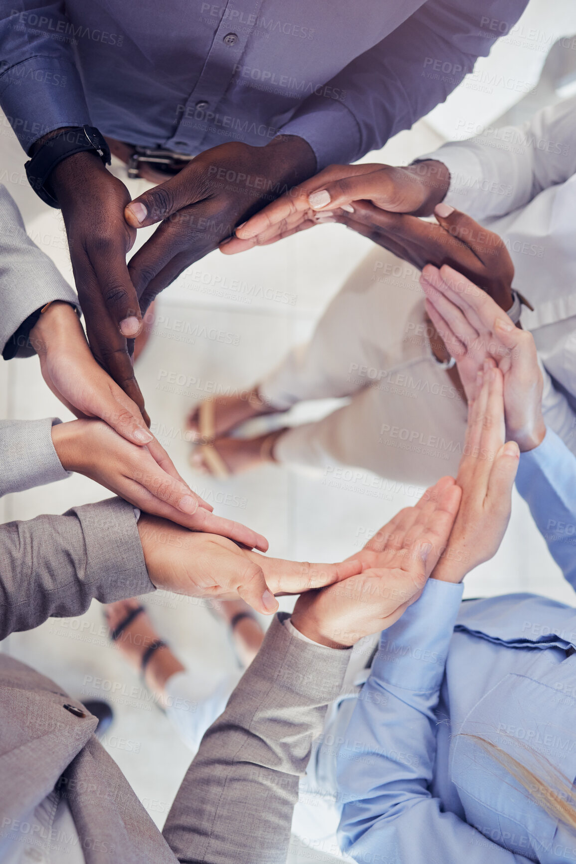 Buy stock photo Hands, collaboration and workflow with a business team standing in a circle at the office from above. Meeting, partnership and teamwork with a group of people in a huddle for growth or synergy