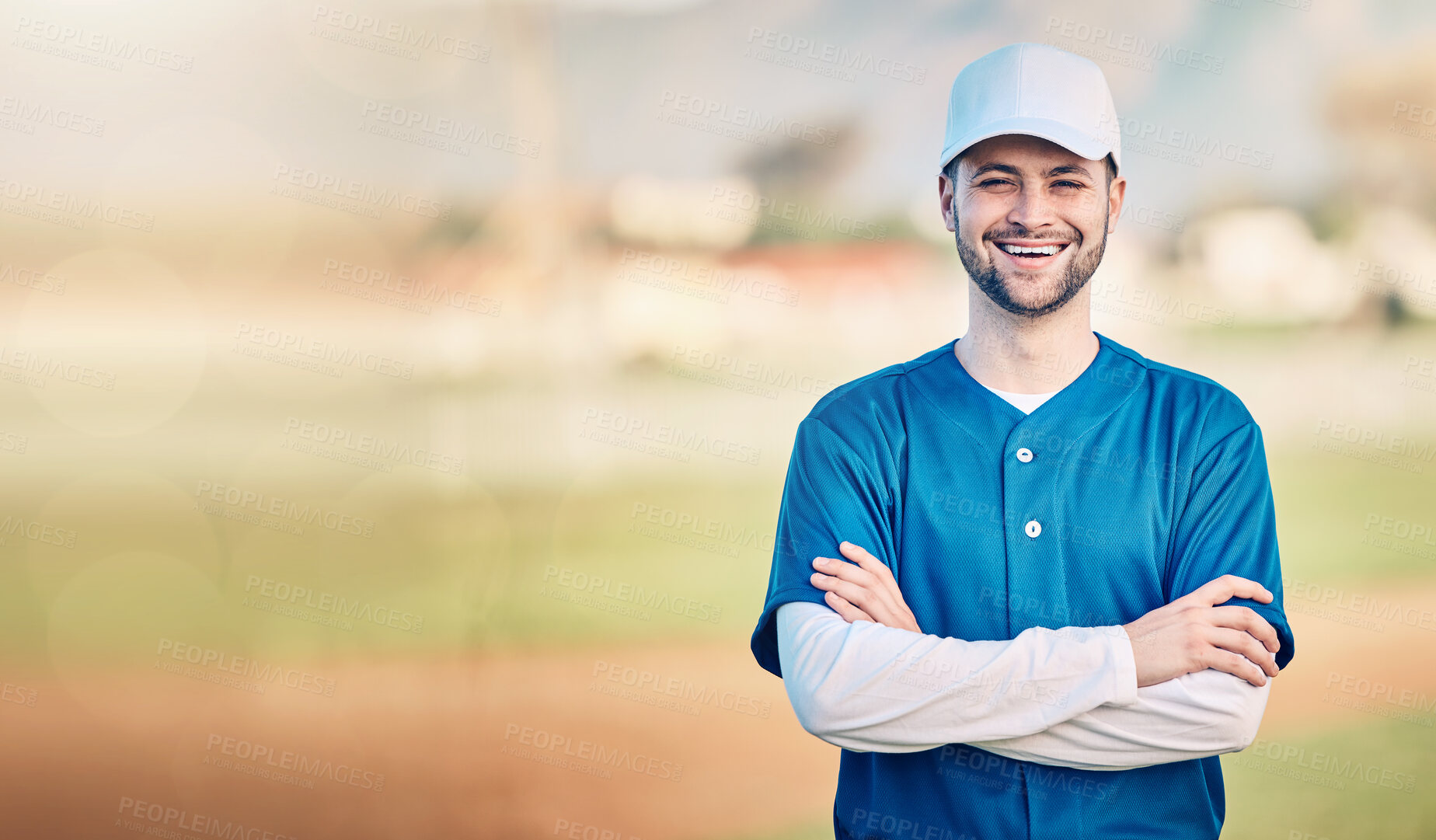 Buy stock photo Portrait, smile and mockup with a baseball man standing arms crossed outdoor on a sports pitch. Fitness, training and happy with a young male athlete posing next to blank mock up space on a field