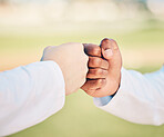 Sports, teamwork and hands for fist bump on field for motivation, support and solidarity outdoors. Thank you greeting, collaboration and hand connection for success, goals and target for competition
