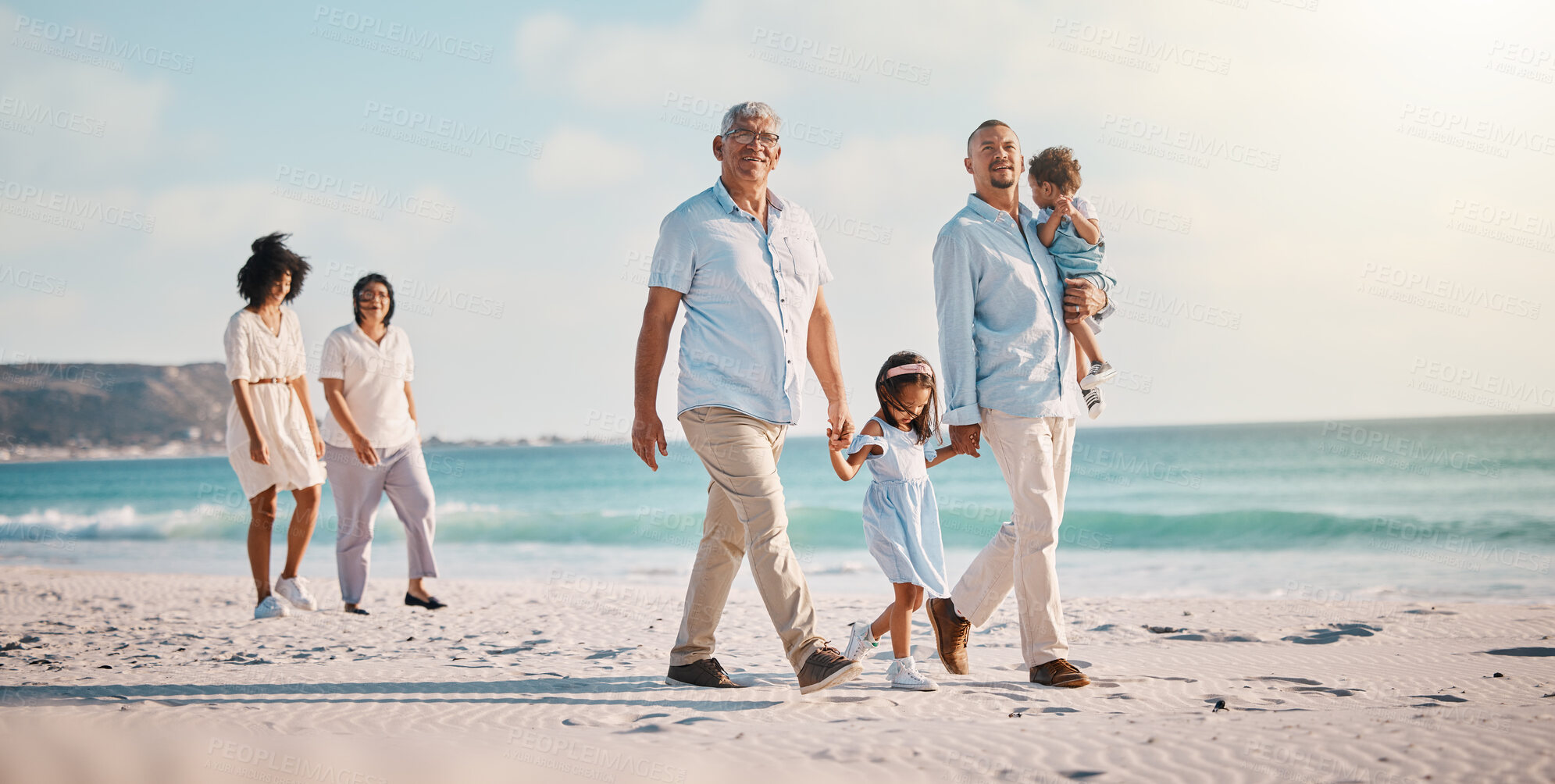 Buy stock photo Grandparents, parents and children walking on beach for holiday, vacation and weekend trip by sea. Travel, summer and kids holding hands with big family for adventure, journey and relaxing together