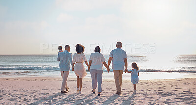 Buy stock photo Grandparents, parents and children walking on beach for holiday, vacation and weekend by sea. Travel, sunset and kids holding hands with big family for adventure, journey and relax for bond together