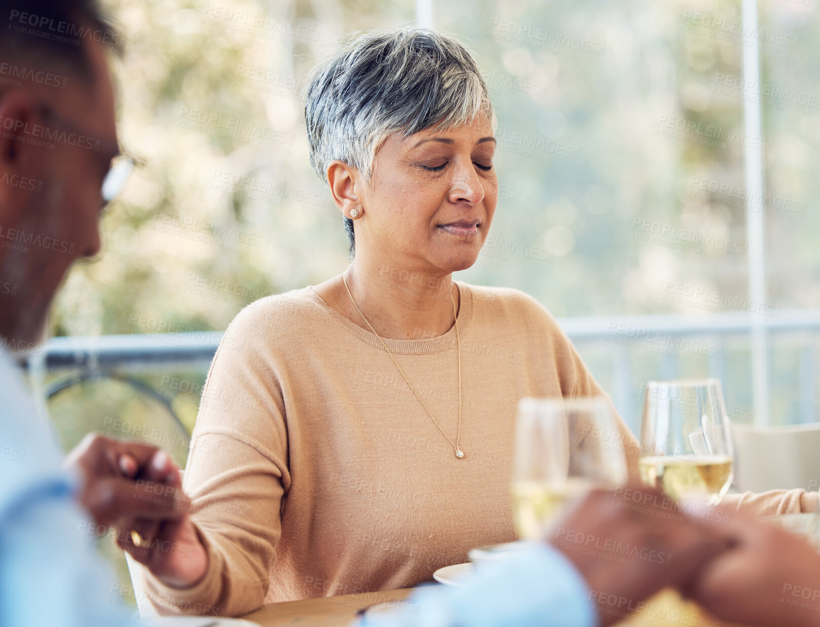 Buy stock photo Praying, grace and mature woman and family praise God before dinner or supper as gratitude being spiritual. Holding hands, religion and thankful Christian people in hope, worship and prayer