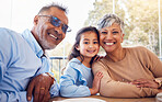 Family, portrait of grandparents and child in cafe on summer holiday together with smile and happiness. Mature man, woman and little girl at table in restaurant for lunch while on vacation with love.