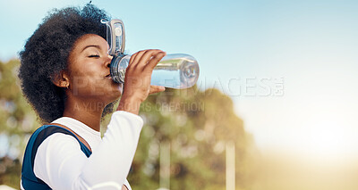 Buy stock photo Sports, black woman and drinking water at field for training, exercise or match against mockup. Hydration, fitness and thirsty athletic girl relax with drink during workout, practice or outdoor game