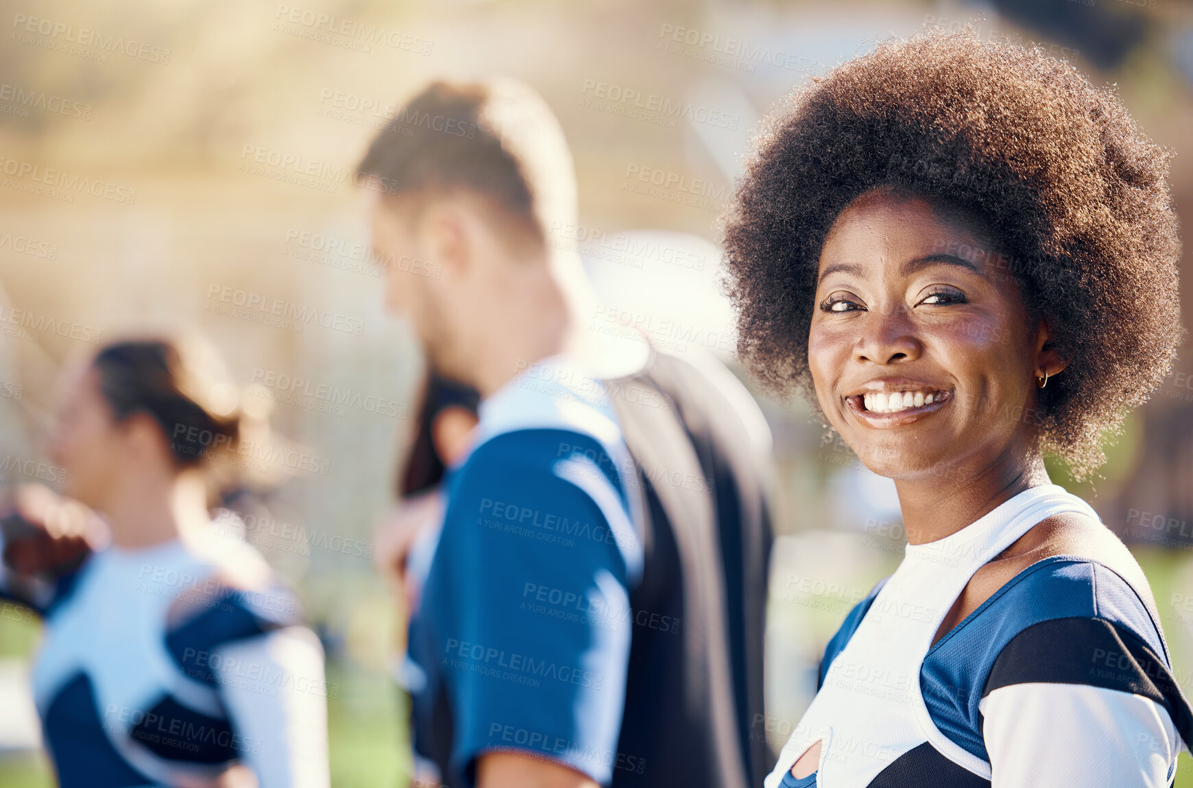 Buy stock photo Happy, sports and portrait of a black woman at cheerleading, rehearsal and team practice. Smile, cheerful and African cheerleader at a sport event, competition or performance with a squad on a field