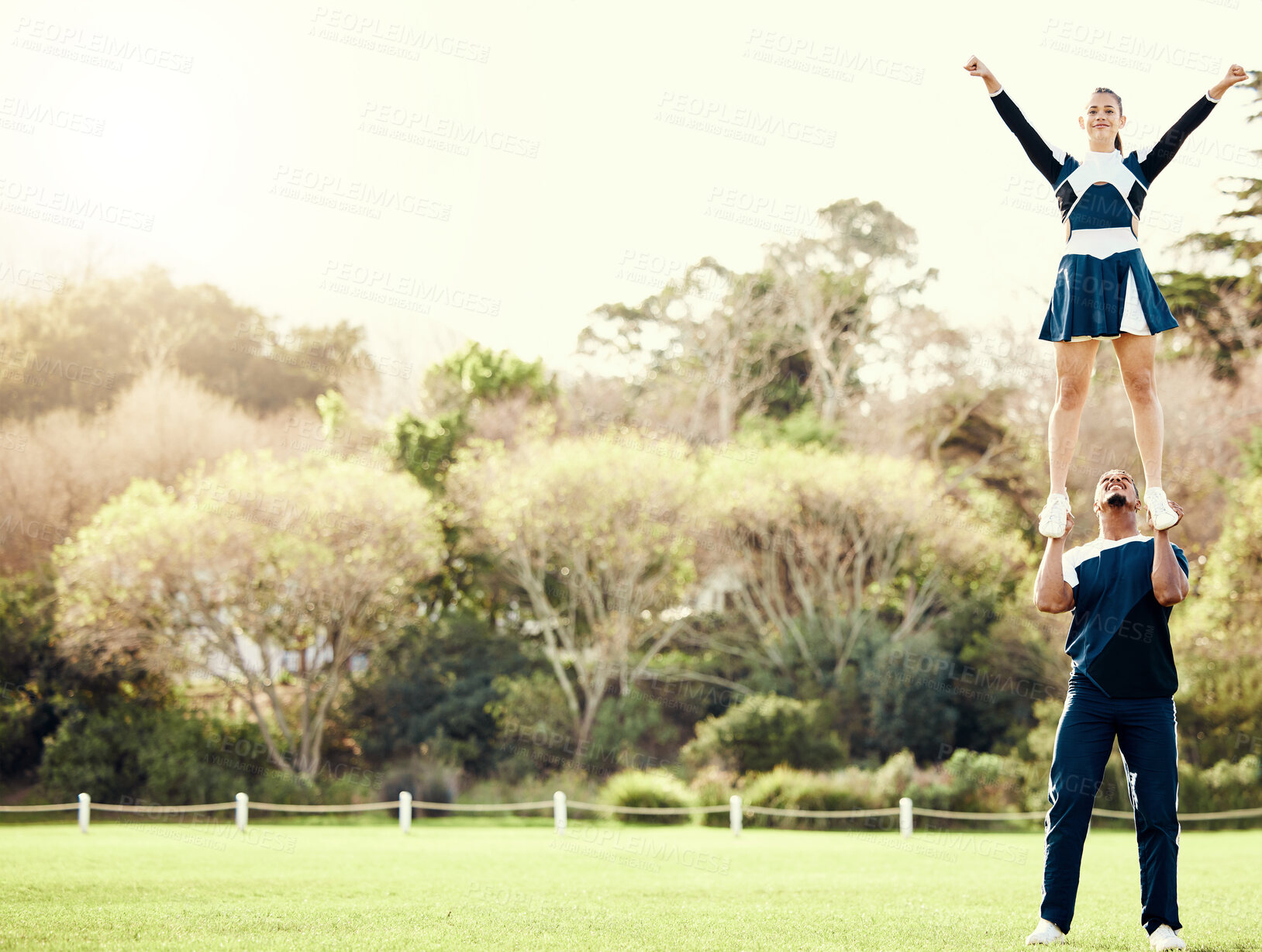 Buy stock photo Cheerleading student, lift and mockup outdoor for on cheer camp with exercise and fitness. Students, air pose and strong male athlete doing training and workout with cardio and mock up in nature