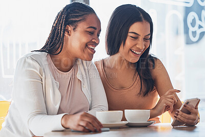 Buy stock photo Women friends, coffee shop and phone with smile, happy and laugh at comic meme on social network. Gen z black woman, smartphone and relax in cafe with blog, funny video or texting app ux on internet