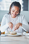 Black woman eating sandwich at restaurant for customer services or experience of breakfast or lunch. Black person or consumer and bagel, burger or food at small business cafe or cafeteria for review 