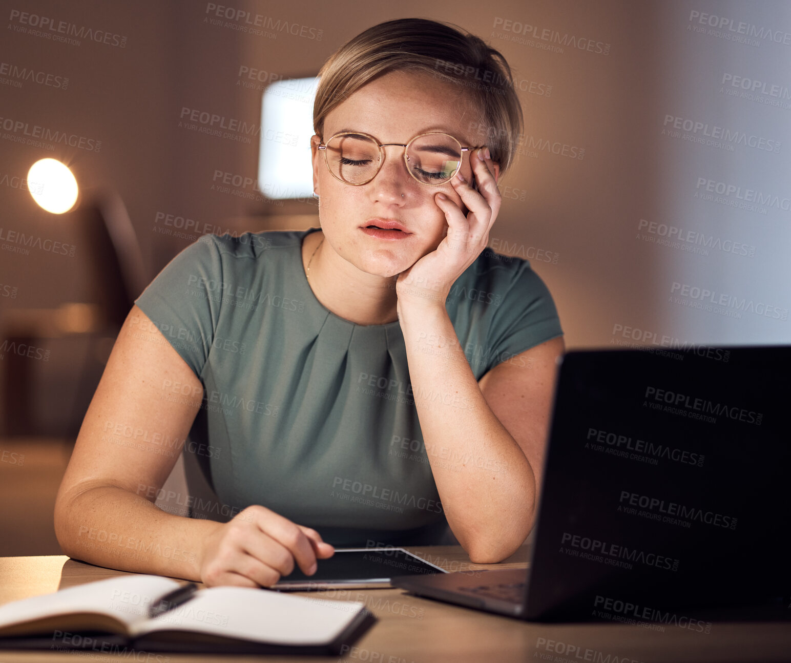 Buy stock photo Tired, sleeping and burnout by business woman working at night in office on laptop for deadline, email or proposal. Sleep, exhausted and corporate employee suffering fatigue, workload and pressure