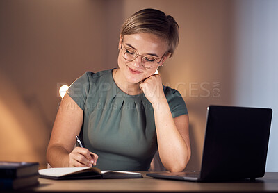 Buy stock photo Business woman, notebook or writing in night office for company planning, schedule or ideas management. Smile, happy or corporate worker with book, laptop technology or project agenda of evening task