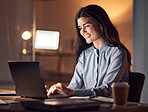 Business woman, computer typing and dark office with tax audit deadline with happiness. Corporate employee, working and happy accountant planning a online finance strategy with a laptop and a smile