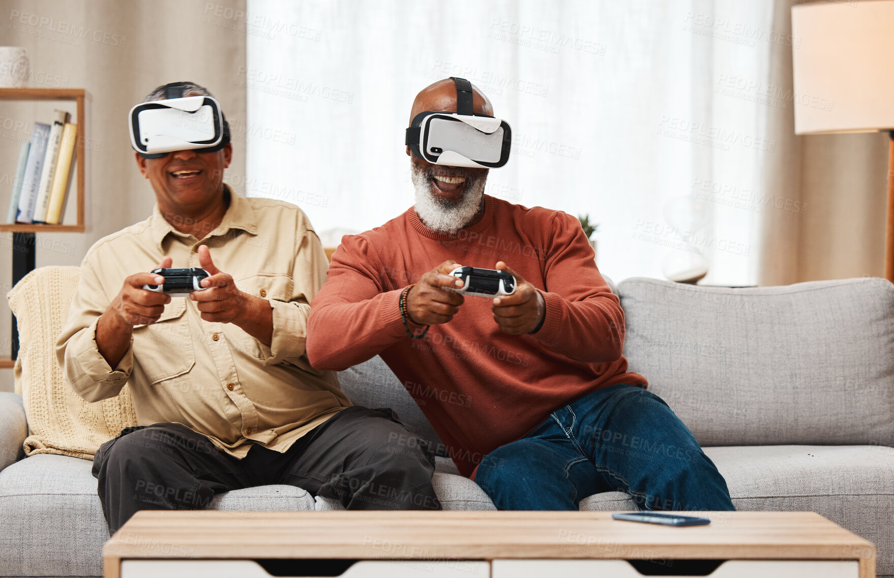 Buy stock photo Friends, virtual reality and senior men gaming in home on sofa in living room while laughing. 3d vr, metaverse gamer and smile of happy retired people playing fun futuristic games with controller.