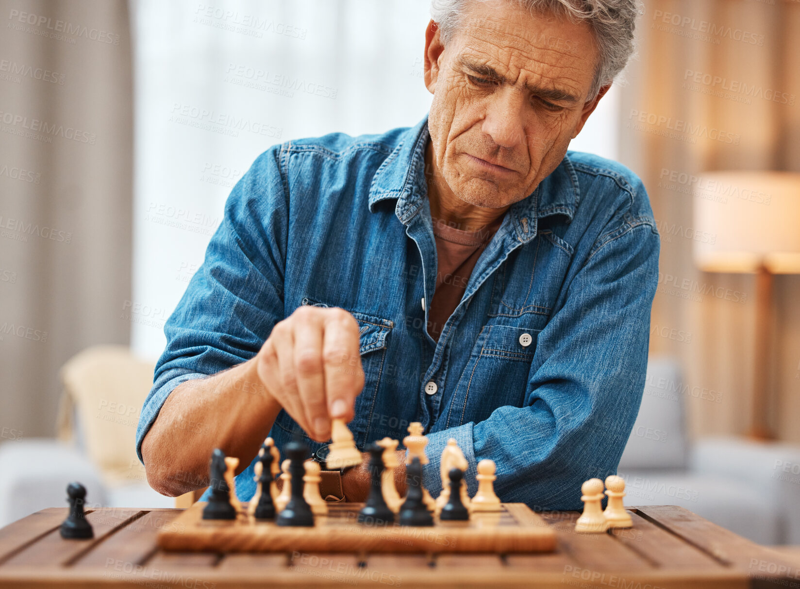 Buy stock photo Chess, play and senior man with board game piece while practicing strategy in home alone. Checkmate, chessboard and retired male playing sports and thinking for problem solving challenge in house.