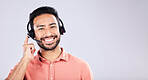 Portrait, call center and mockup with a man customer service consultant in studio on a gray background. Contact us, crm or support and a male employee consulting with a headset on empty space