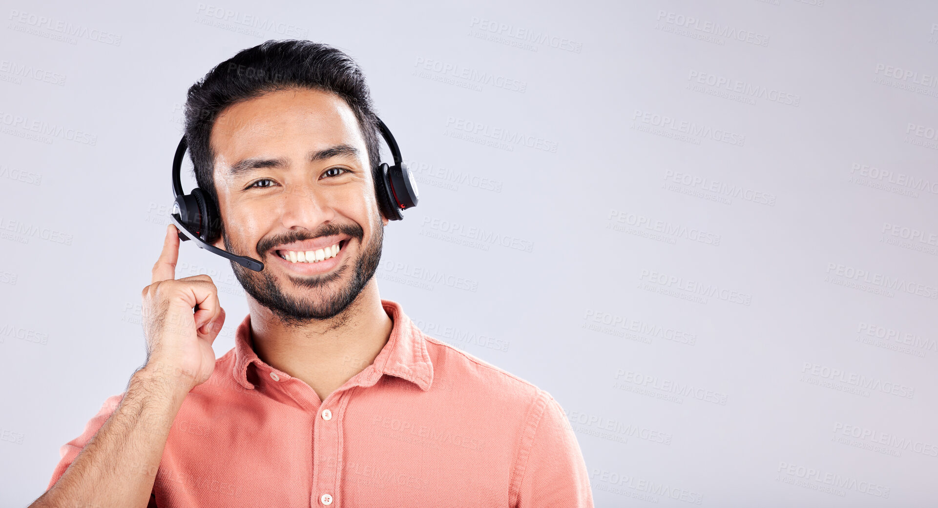 Buy stock photo Portrait, call center and mockup with a man customer service consultant in studio on a gray background. Contact us, crm or support and a male employee consulting with a headset on empty space