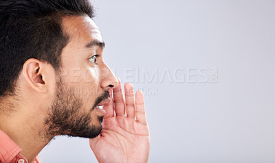 Buy stock photo Whisper, talking and asian man with a secret on mockup isolated on a grey studio background. Announcement, space and guy speaking, sharing opinion and gossip for discussion and communication