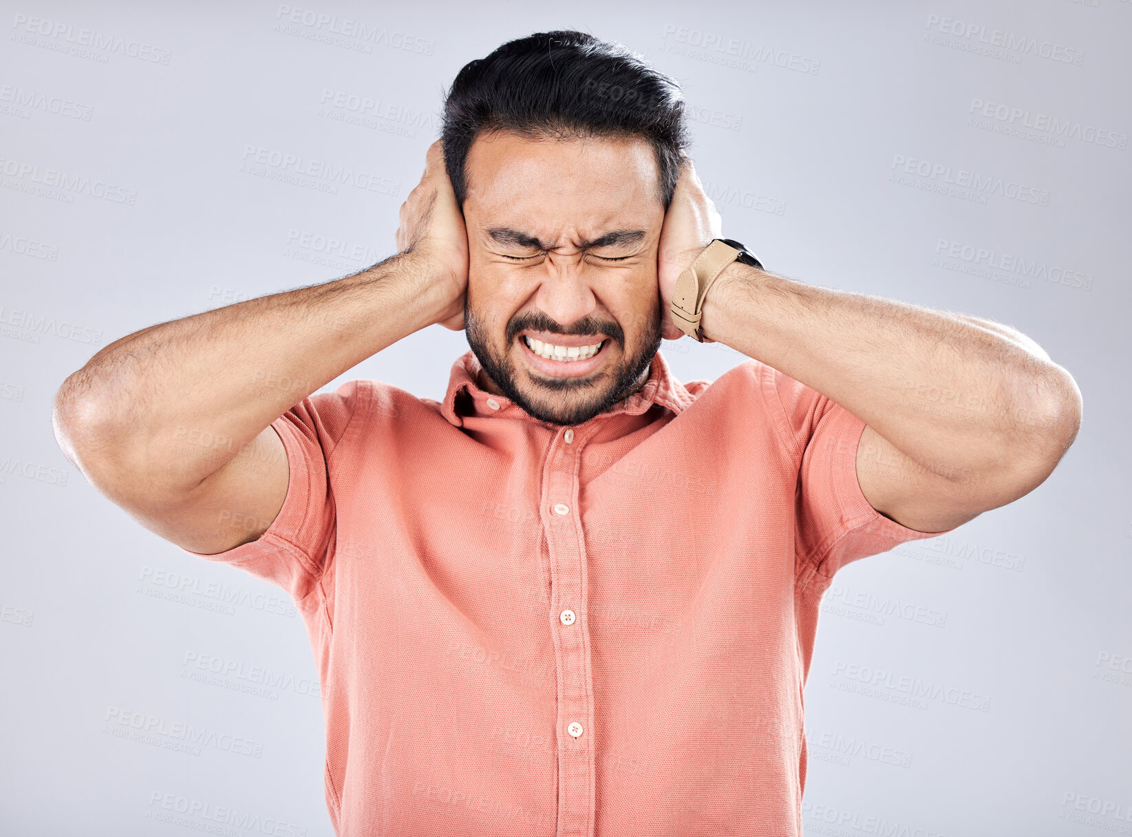 Buy stock photo Loud, mental health and angry Asian man with schizophrenia isolated on a grey studio background. Stress, fear and scared guy closing ears for noise, scared and bipolar pressure on a backdrop