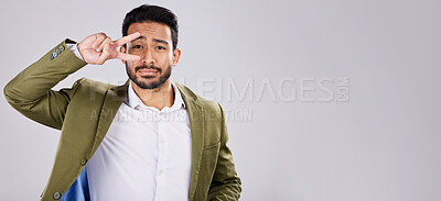 Buy stock photo Portrait, peace and mockup with a business man in studio on a gray background for branding or advertising. Marketing, mock up and hand sign with a male employee indoor to promote product placement