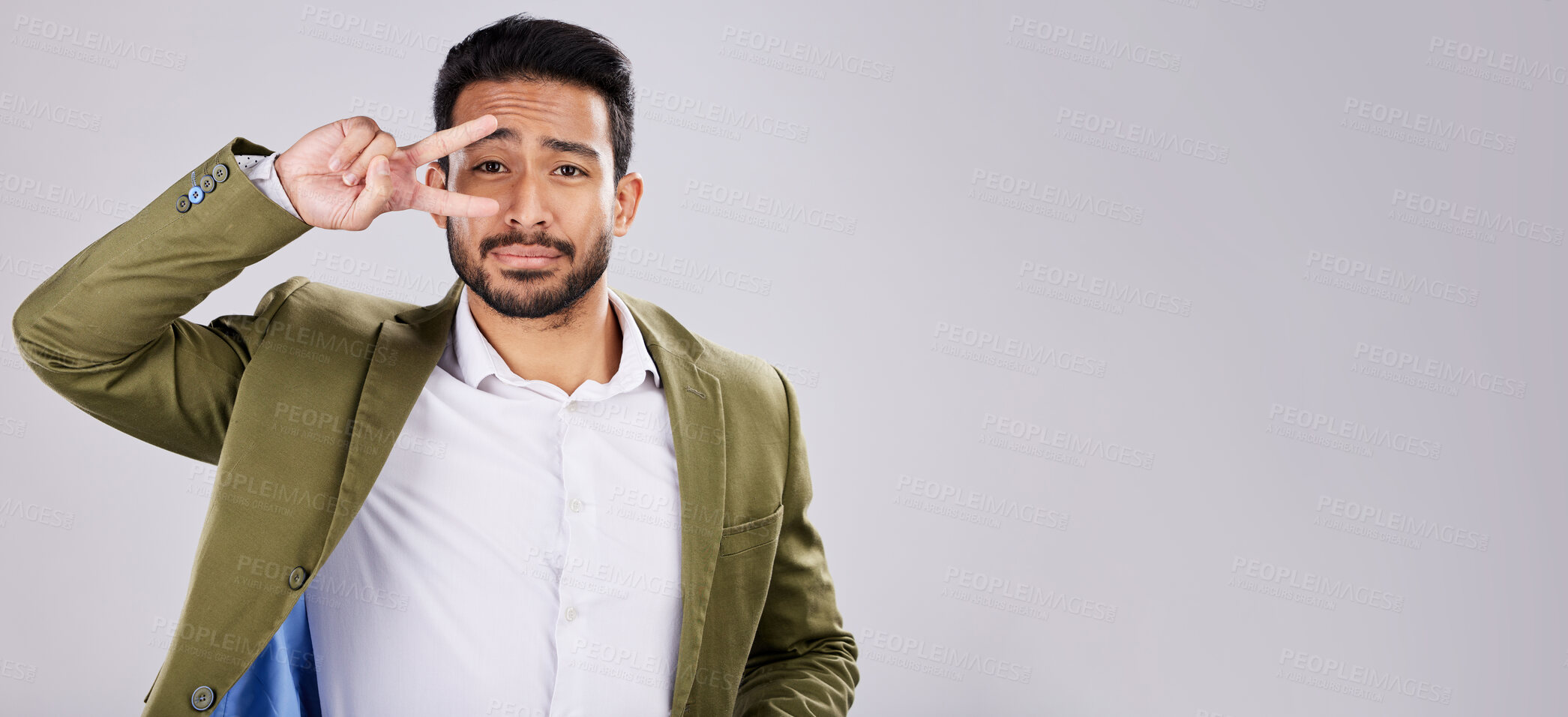 Buy stock photo Portrait, peace and mockup with a business man in studio on a gray background for branding or advertising. Marketing, mock up and hand sign with a male employee indoor to promote product placement