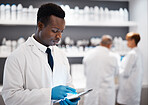 Science, black man and tablet with research, chemist and connection for typing, laboratory and focus. African American male employee, researcher and scientist with device, future or telehealth in lab