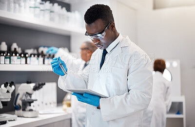 Buy stock photo Science, research and black man in laboratory with tablet for medical analysis and digital innovation in medicine. Pharmaceutical analytics, web and scientist in South Africa checking results online.