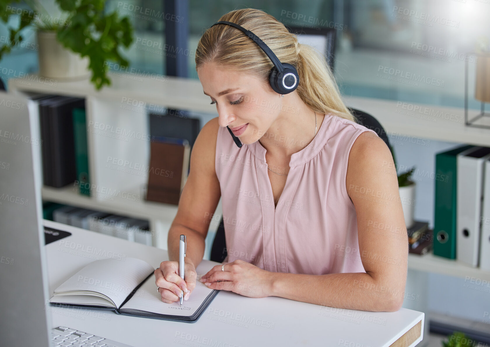 Buy stock photo Woman, call center and writing in notebook by office desk for record keeping, reminder or planning. Happy female consultant taking notes in book for customer service, support or idea to schedule task