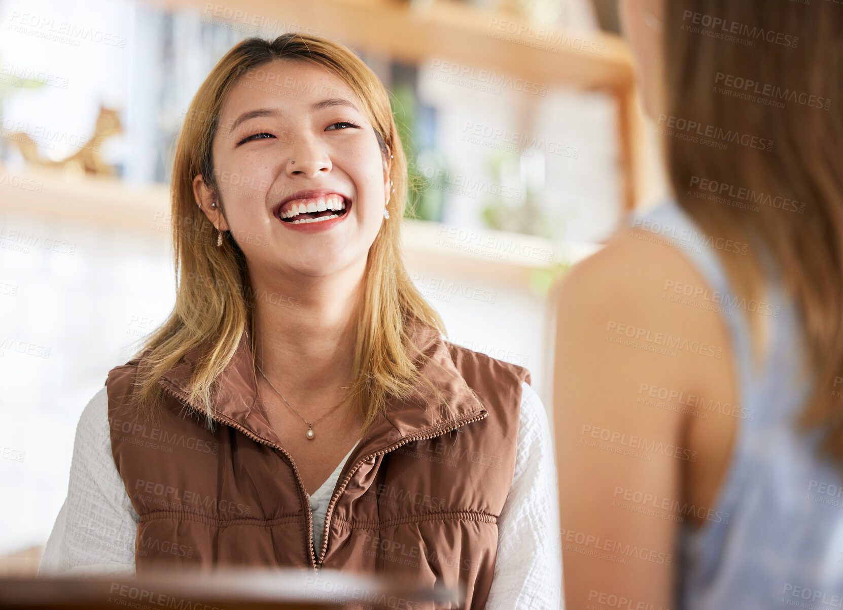 Buy stock photo Smile, friendship and women laughing together in cafe, happy talking and gossip or joke on weekend. Happy, laugh and smiling friends in restaurant for brunch date with asian woman and friend at table