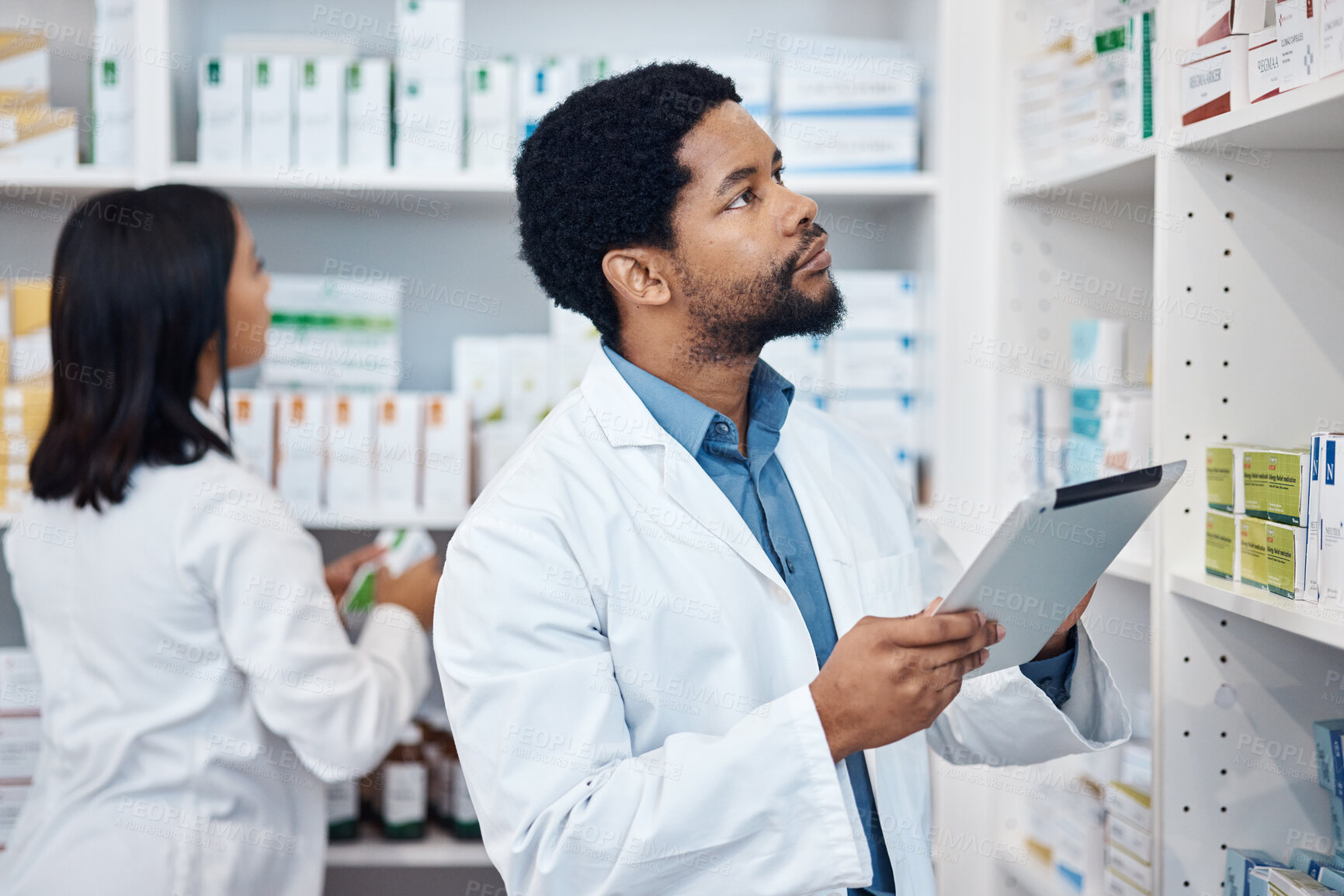 Buy stock photo Pharmacy stock check, black man and tablet checklist of medicine and pills. Pharmacist, digital work and pharmaceutical products in a retail shop or clinic with healthcare and wellness employee 