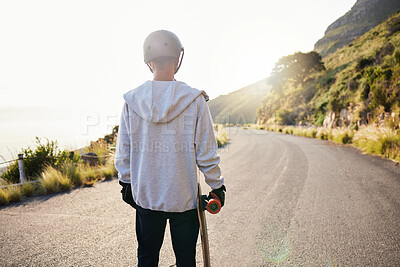 Buy stock photo Skateboard, road and athlete doing training, exercise and fitness on a hill. Sun, man back and summer sport of a young person ready for balance and freedom from extreme sports outdoor in sunshine