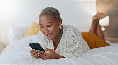 Bed, phone and a black woman surfing social media and laughing at funny video. Relax, browse and click like on post on internet. Laugh and smile at streaming site for entertainment online in bedroom.