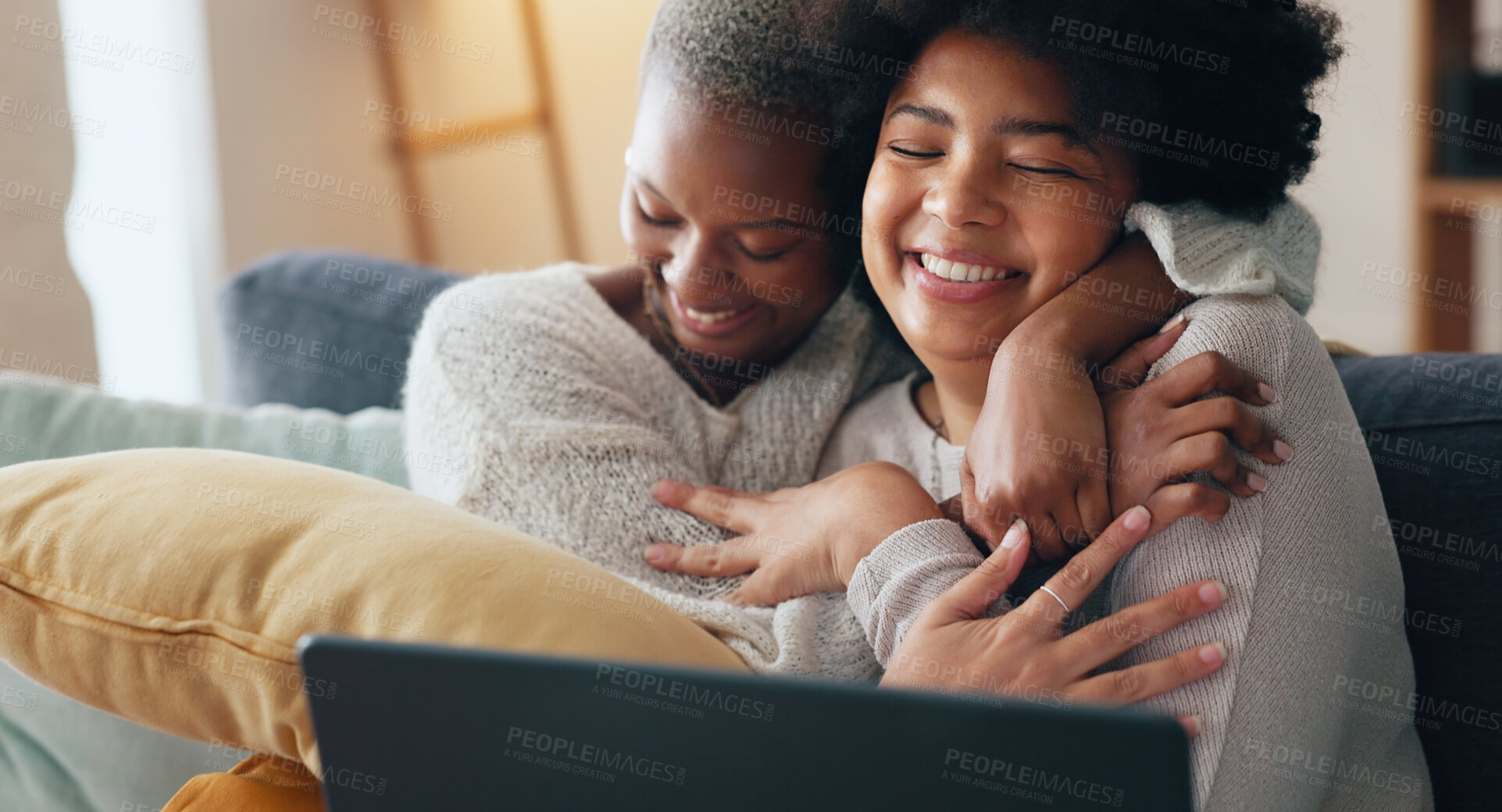 Buy stock photo Laptop, news and excited lesbian couple hug in celebration of email, success or home loan approval on a sofa. LGBT, love and women embrace in a living room with online credit score, mortgage or win