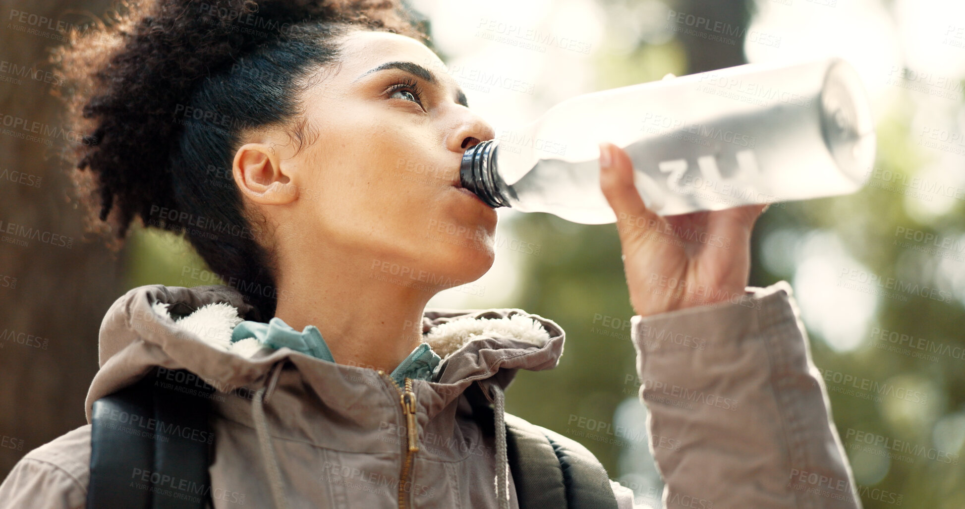 Buy stock photo Water, hiking and woman in nature for fitness, exercise or travel in mountains of Portugal with backpack, bottle and goal. Healthy, drink and girl on break in trekking adventure in forest or woods