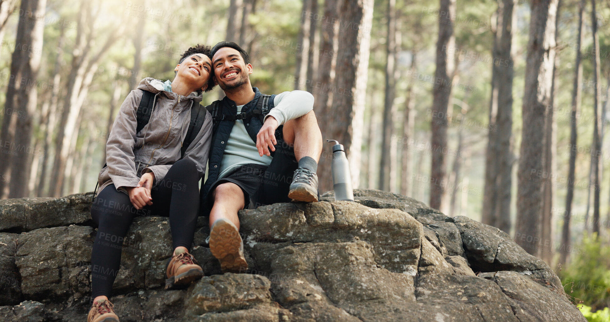 Buy stock photo Hug, hiking or a couple relax on trail in forest, commitment or sitting on a rock with holiday. Health, man or woman with vacation, natural landscape or marriage with fitness or freedom with wellness