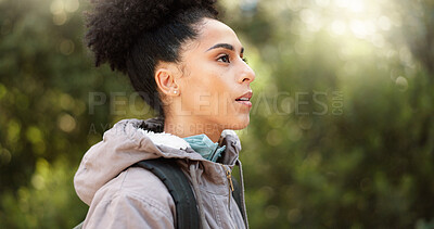 Hiking, thinking and adventure with a black woman in nature, sightseeing while walking on a trail outdoor. Freedom, travel and health with a young female hiker out for discovery and exploration
