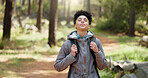 Hiking, thinking and adventure with a black woman in nature, sightseeing while walking on a trail outdoor. Freedom, travel and health with a young female hiker out for discovery and exploration