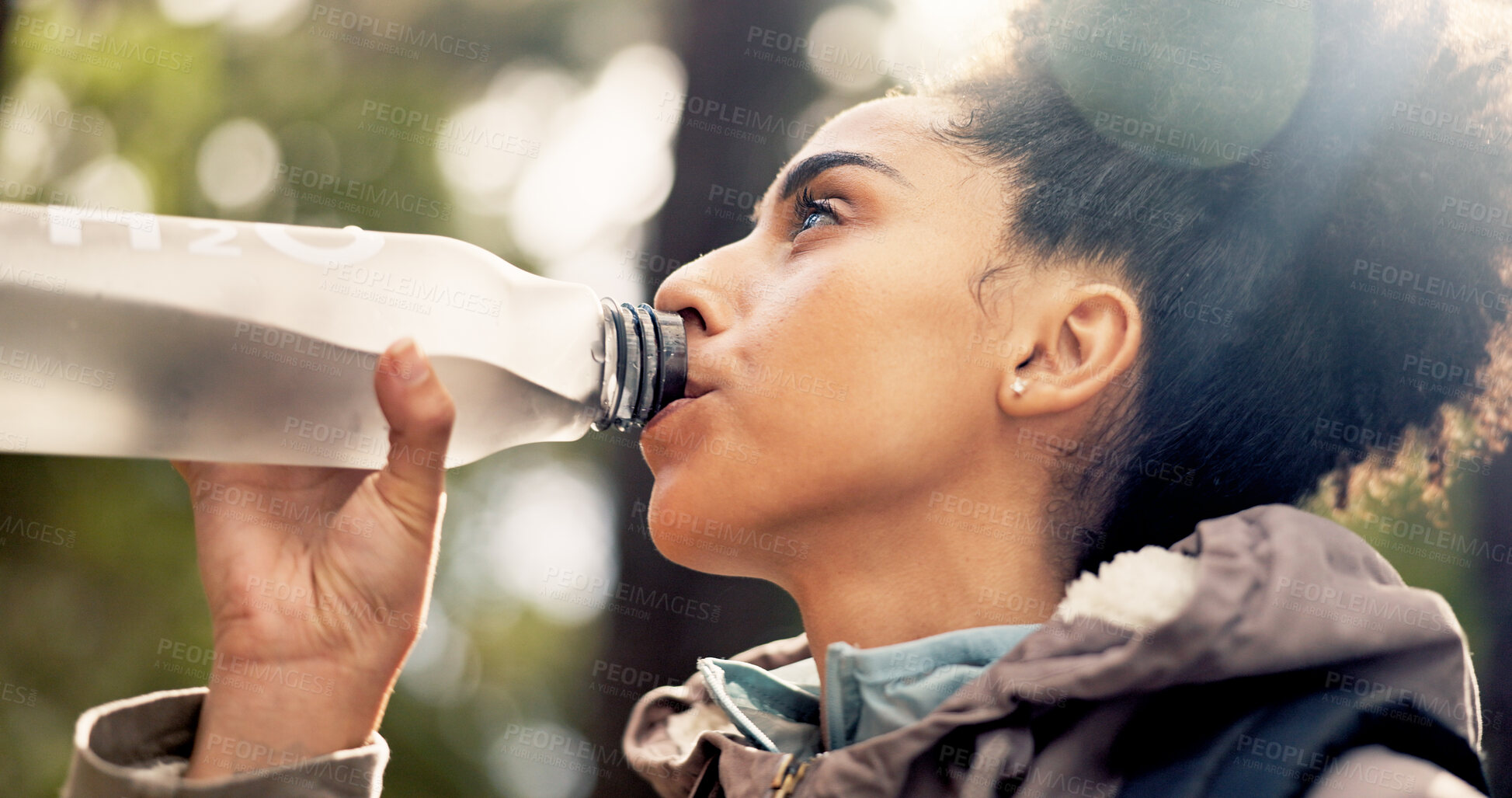 Buy stock photo Nature, health and a woman hiking and drinking water on adventure trail with trees in summer. Thinking, fitness and freedom with female person in forest with bottle drink for hydration with exercise