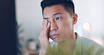 Asian businessman, tired and hand on face in communication office, headache and marketing company. Man, computer or late night reading with burnout, target or kpi at digital marketing agency in Tokyo