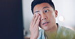 Asian businessman, tired and hand on face in communication office, headache and marketing company. Man, computer or late night reading with burnout, target or kpi at digital marketing agency in Tokyo