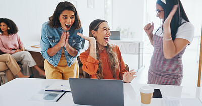 Success, fist bump or happy employees with a handshake in celebration of digital marketing sales goals at office desk. Laptop, winner or excited women celebrate winning an online business deal at job Success, fist bump or happy employees with a handshake