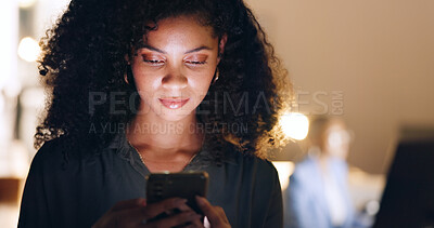 Social media, phone and black woman in a dark office for a corporate deadline at night. African worker, manager or employee typing on a mobile app with a smartphone while working overtime at work