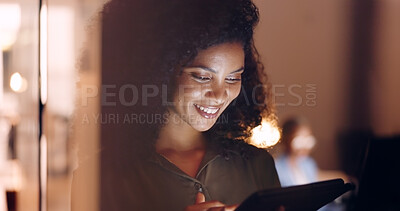 Office, night and happy black woman on a phone at her job in the dark smiling about funny text. Business, technology and social media mobile app scroll of a person working late on a work break