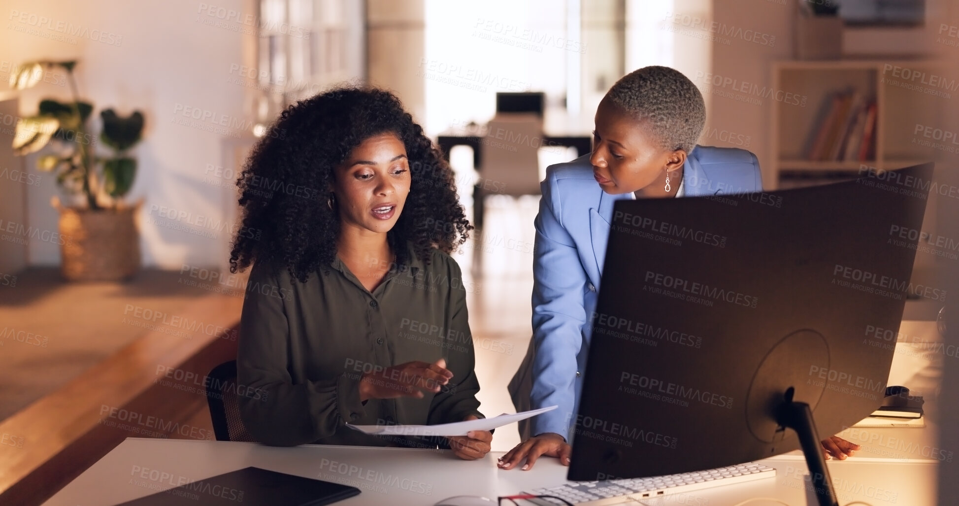 Buy stock photo Documents, computer and business women at night working on project, deadline and planning together. Collaboration, teamwork and workers in discussion for proposal, report and schedule in overtime