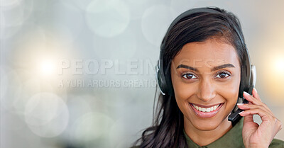 Happy, friendly and excited face of a call center agent smiling sitting in her office with copy space. Portrait of a female customer service employee wearing a headset with copyspace at her workplace